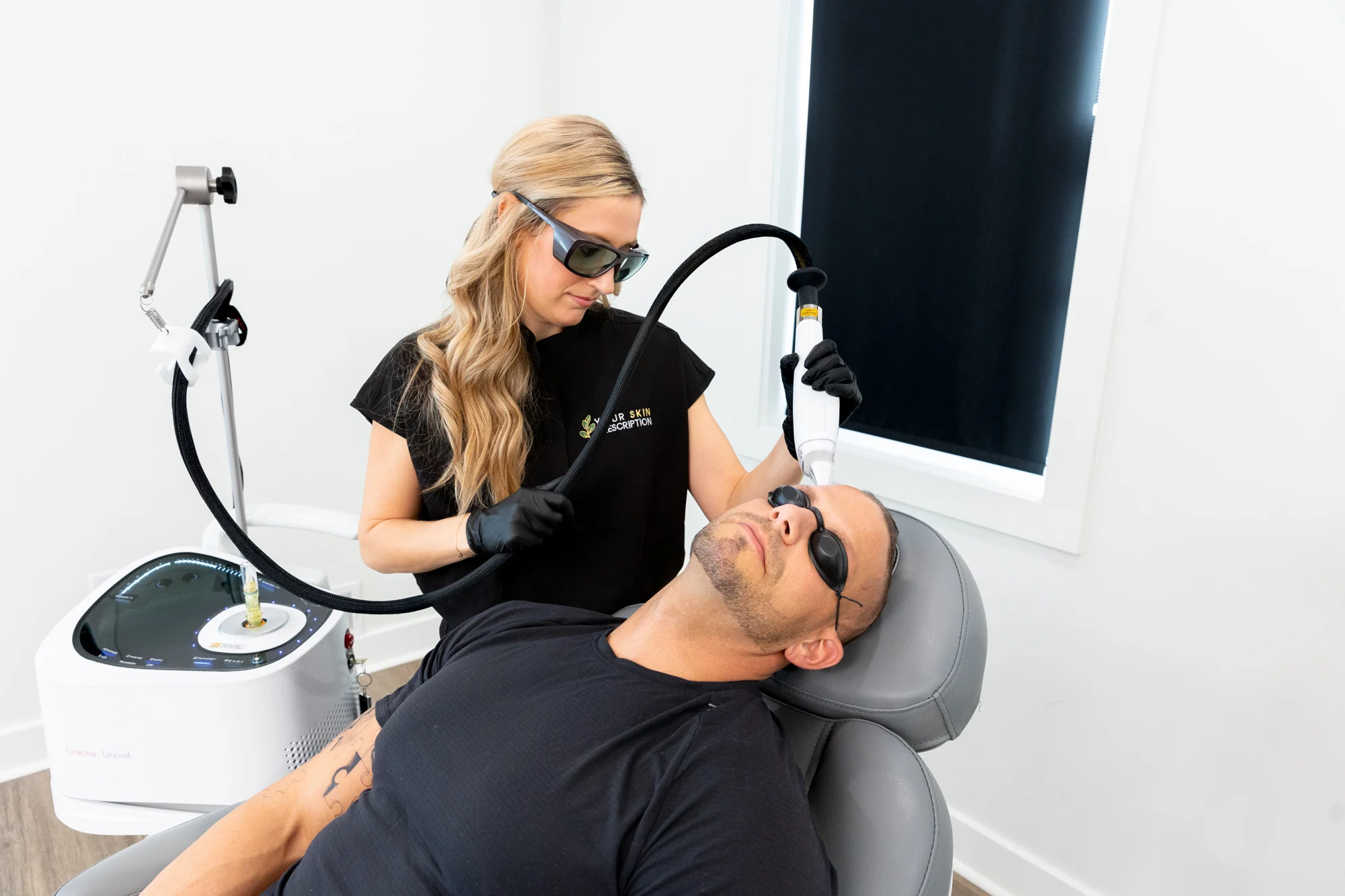 A provider at Your Skin Prescription performing hair restoration in Sewickley on a mans scalp.