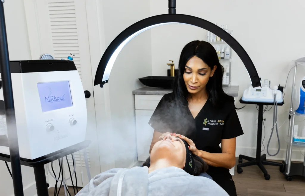 A med spa provider is performing a skin care procedure on a woman near Pittsburgh