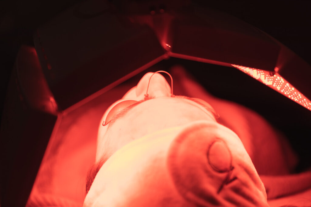 Close up of a med spa patient in a light therapy bed near McCandless, PA