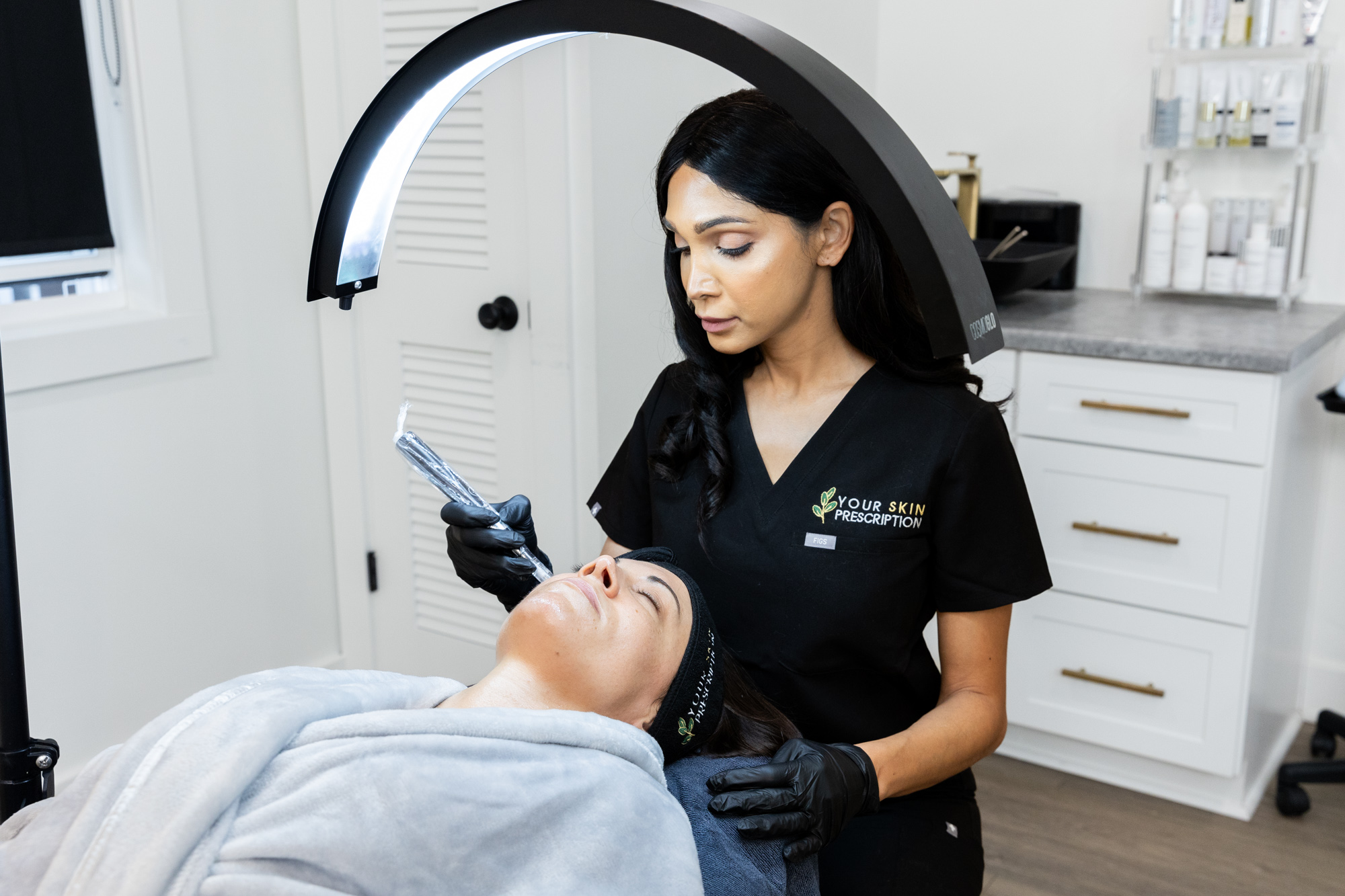 A Your Skin Prescription provider performs microneedling on a woman near Pittsburgh